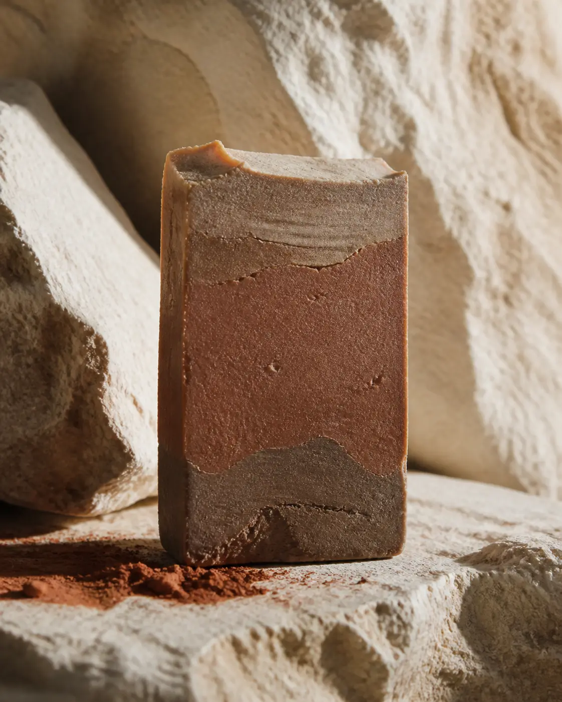 Jabón Tierra de tono arcilla sobre piedra